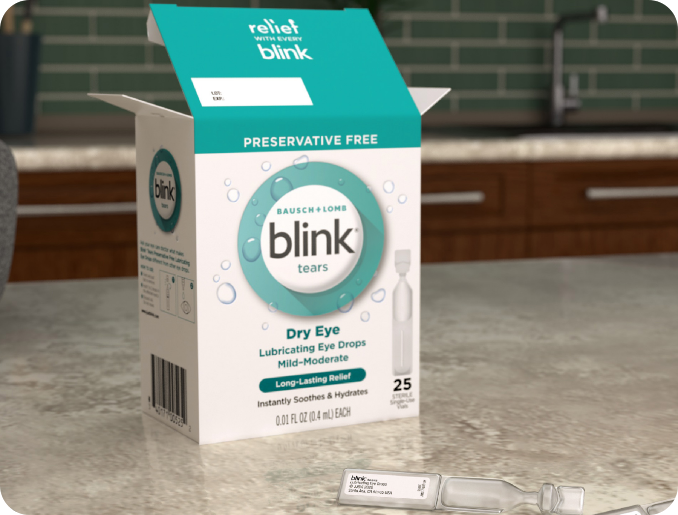 Single-use vial of Blink Tears Preservative Free lies on a counter next to its carton