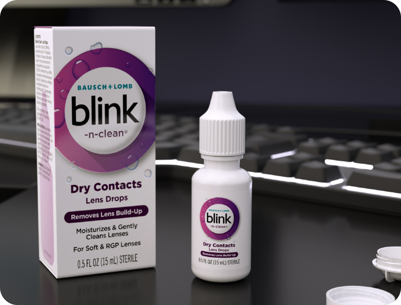 Blink-N-Clean Lens Drops bottle and carton on a desk in front of a keyboard